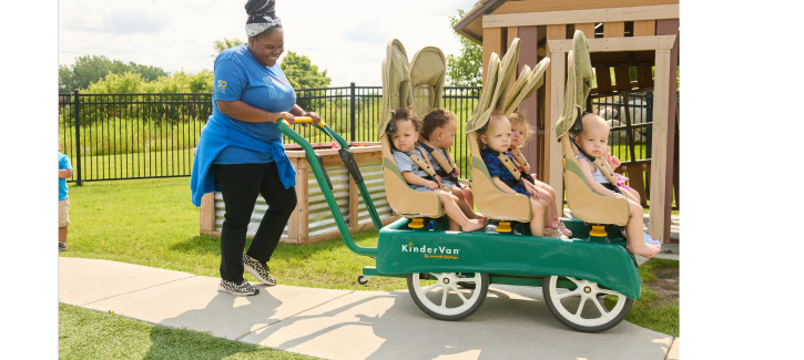 http://Infant%20teacher%20taking%20a%20group%20of%20babies%20on%20a%20buggy%20ride%20outdoors%20at%20school